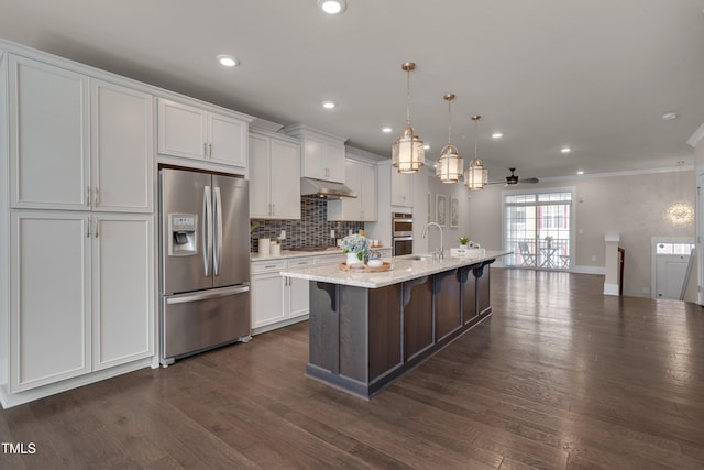 10330 Sablewood Dr Unit 104, Raleigh, NC 27617 - kitchen with appliances with stainless steel finishes, under cabinet range hood, crown molding, white cabinets, and a ceiling fan