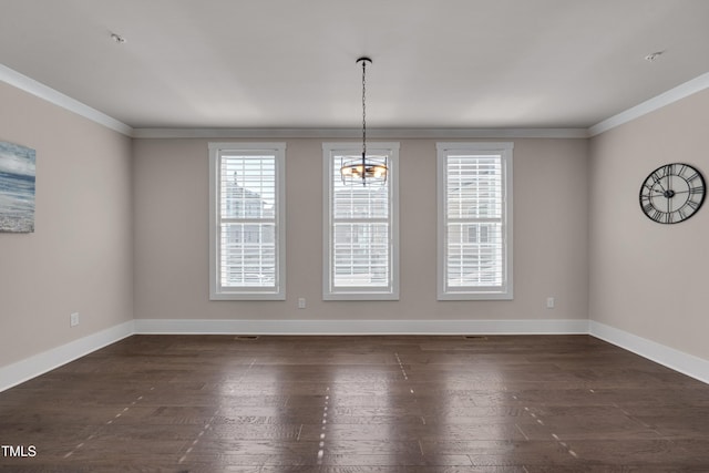 10330 Sablewood Dr Unit 104, Raleigh, NC 27617 - unfurnished dining area with dark wood-type flooring, crown molding, and a chandelier