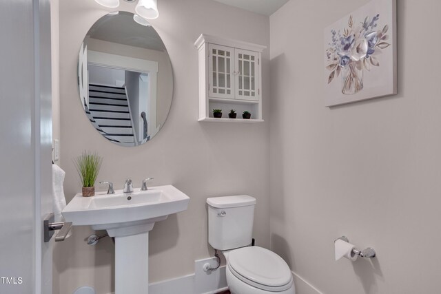 10330 Sablewood Dr Unit 104, Raleigh, NC 27617 - half bath featuring toilet and baseboards