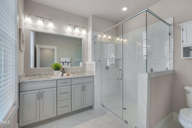 10330 Sablewood Dr Unit 104, Raleigh, NC 27617 - bathroom with double vanity, a stall shower, marble look tile flooring, and recessed lighting