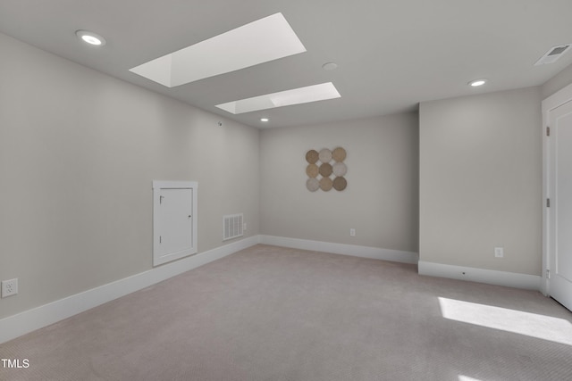 10330 Sablewood Dr Unit 104, Raleigh, NC 27617 - empty room with a skylight, light colored carpet, and recessed lighting