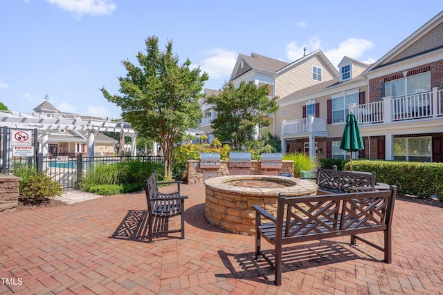 10330 Sablewood Dr Unit 104, Raleigh, NC 27617 - view of patio / terrace featuring area for grilling, a pergola, and a residential view