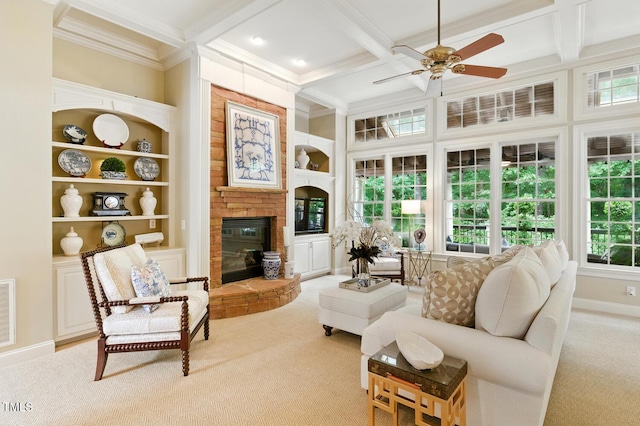 671 Bear Tree Crk, Chapel Hill, NC 27517 - living area featuring light colored carpet, coffered ceiling, crown molding, ceiling fan, and a glass covered fireplace