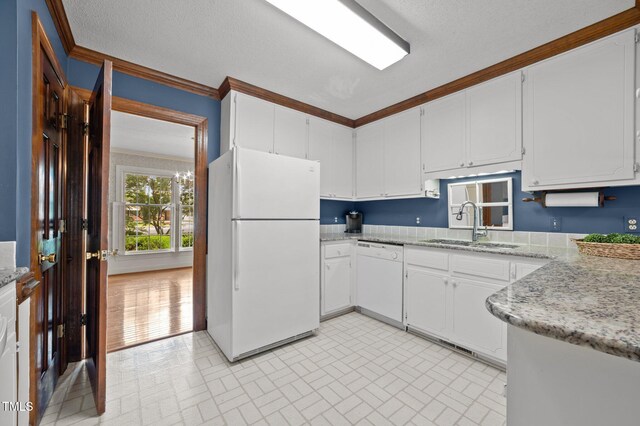 2610 N Main St, Tarboro, NC 27886 - kitchen featuring white appliances, brick patterned flooring, white cabinetry, a sink, and ornamental molding
