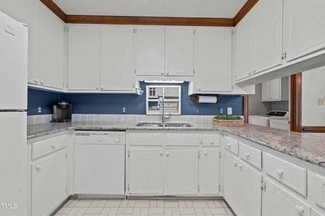 2610 N Main St, Tarboro, NC 27886 - kitchen featuring white appliances, a sink, washer and clothes dryer, white cabinets, and light floors
