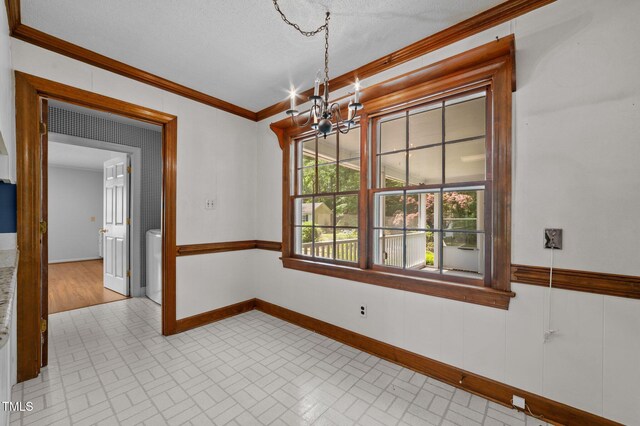 2610 N Main St, Tarboro, NC 27886 - unfurnished dining area with brick patterned floors, a chandelier, baseboards, and ornamental molding