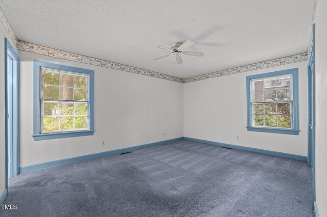2610 N Main St, Tarboro, NC 27886 - unfurnished room with a ceiling fan, carpet floors, a textured ceiling, and baseboards