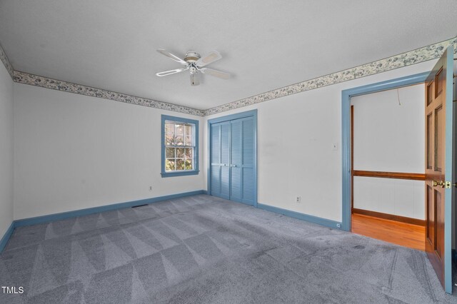 2610 N Main St, Tarboro, NC 27886 - unfurnished bedroom featuring carpet flooring, baseboards, and a closet
