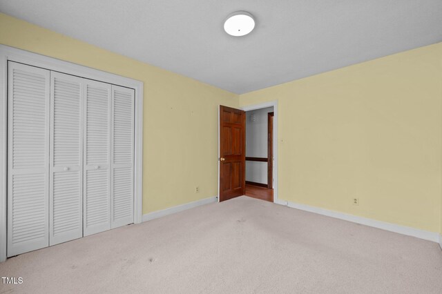 2610 N Main St, Tarboro, NC 27886 - unfurnished bedroom featuring carpet floors, baseboards, and a closet