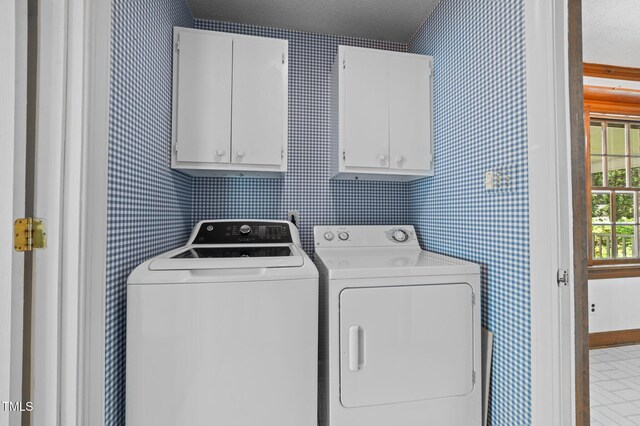 2610 N Main St, Tarboro, NC 27886 - laundry room with cabinet space, independent washer and dryer, wallpapered walls, and baseboards