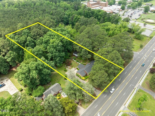 2610 N Main St, Tarboro, NC 27886 - view of property location with property boundaries highlighted and a heavily wooded area