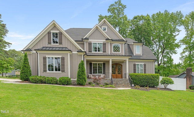 5308 Montclair Dr, Raleigh, NC 27609 - craftsman-style house featuring covered porch, a standing seam roof, board and batten siding, a shingled roof, and metal roof
