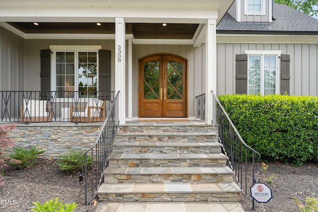 5308 Montclair Dr, Raleigh, NC 27609 - entrance to property featuring a shingled roof, board and batten siding, and covered porch