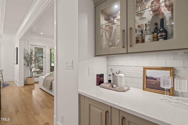 5308 Montclair Dr, Raleigh, NC 27609 - bar area with crown molding, tasteful backsplash, light wood-type flooring, baseboards, and recessed lighting