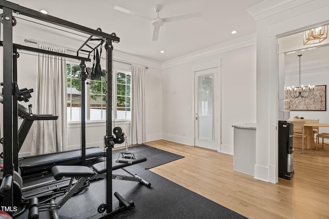5308 Montclair Dr, Raleigh, NC 27609 - workout area with a chandelier, crown molding, baseboards, ceiling fan, and light wood finished floors
