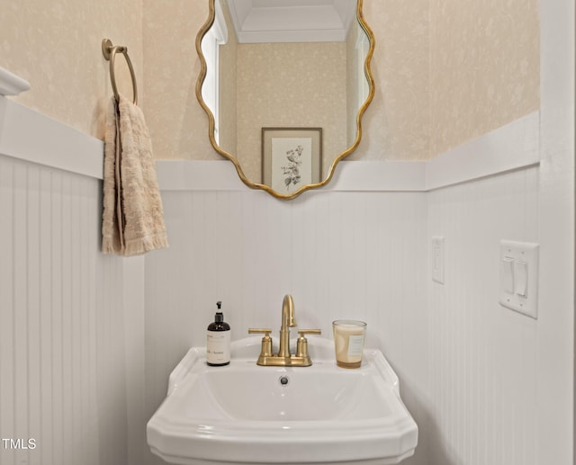 5308 Montclair Dr, Raleigh, NC 27609 - bathroom featuring a sink and wainscoting