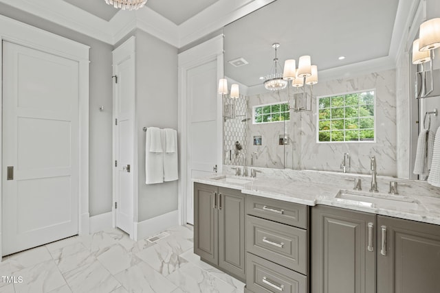 5308 Montclair Dr, Raleigh, NC 27609 - bathroom with a chandelier, marble finish flooring, double vanity, baseboards, and a marble finish shower