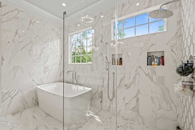 5308 Montclair Dr, Raleigh, NC 27609 - bathroom featuring a freestanding bath, healthy amount of natural light, a marble finish shower, marble tiled flooring, and tile walls