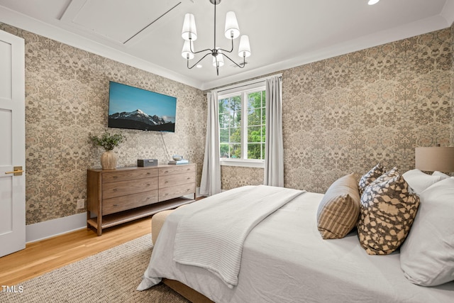 5308 Montclair Dr, Raleigh, NC 27609 - bedroom featuring wood finished floors, ornamental molding, wallpapered walls, baseboards, and a chandelier