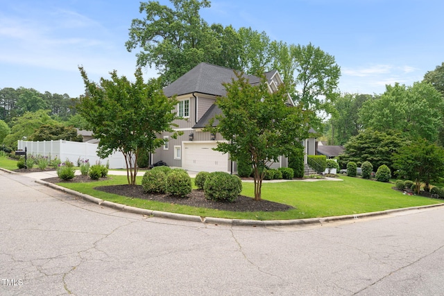 5308 Montclair Dr, Raleigh, NC 27609 - view of property hidden behind natural elements featuring a garage and roof with shingles