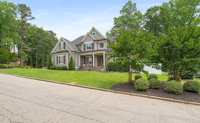 5308 Montclair Dr, Raleigh, NC 27609 - craftsman-style home featuring a front lawn, board and batten siding, and covered porch