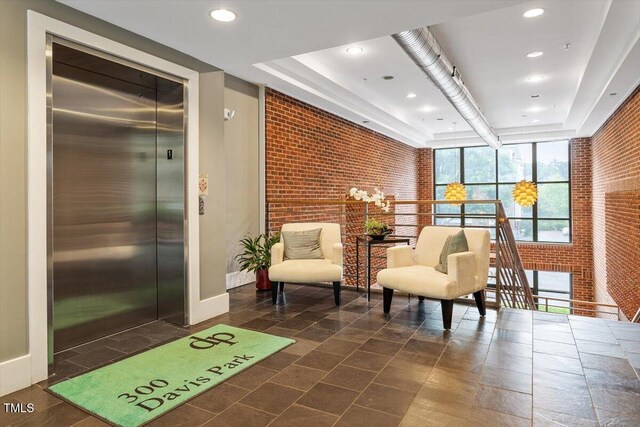 300 Finsbury St Unit 109, Durham, NC 27703 - community lobby with brick wall and recessed lighting