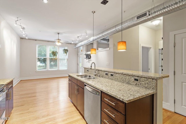 300 Finsbury St Unit 109, Durham, NC 27703 - kitchen with stainless steel appliances, a sink, light wood-style floors, track lighting, and ceiling fan