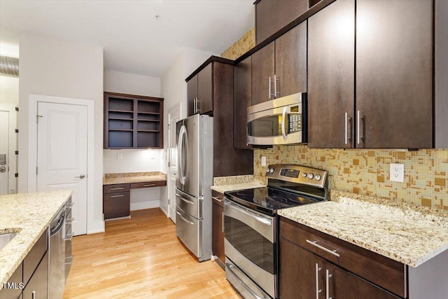 300 Finsbury St Unit 109, Durham, NC 27703 - kitchen with appliances with stainless steel finishes, light wood finished floors, open shelves, and dark brown cabinetry