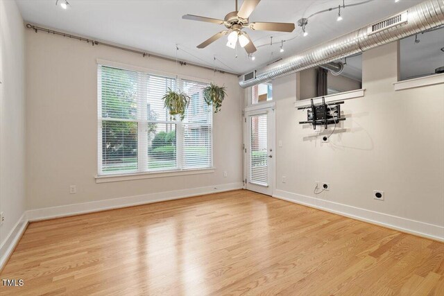 300 Finsbury St Unit 109, Durham, NC 27703 - empty room with wood finished floors, ceiling fan, and plenty of natural light