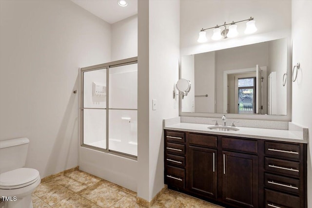 300 Finsbury St Unit 109, Durham, NC 27703 - bathroom featuring vanity, bath / shower combo with glass door, toilet, and baseboards