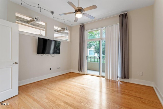 300 Finsbury St Unit 109, Durham, NC 27703 - spare room featuring light wood-type flooring, a ceiling fan, and baseboards