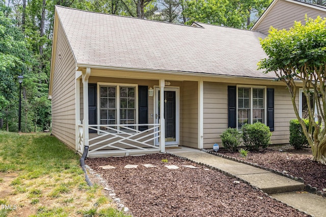 17 Crystal Oaks Ct, Durham, NC 27707 - single story home with a shingled roof and a porch