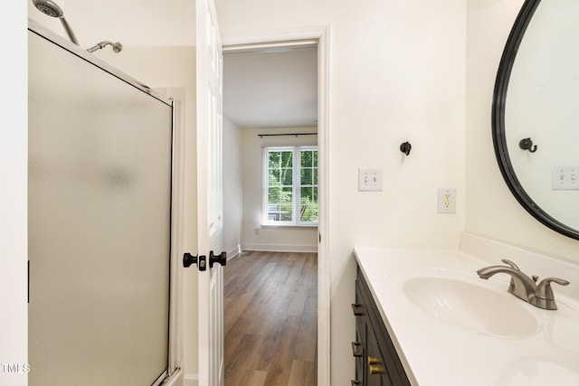 17 Crystal Oaks Ct, Durham, NC 27707 - full bath with a shower stall, vanity, wood finished floors, and baseboards