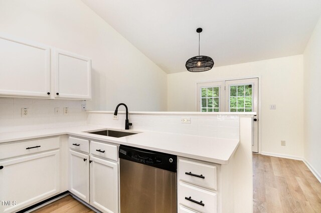 17 Crystal Oaks Ct, Durham, NC 27707 - kitchen featuring dishwasher, a sink, a peninsula, backsplash, and light wood-type flooring