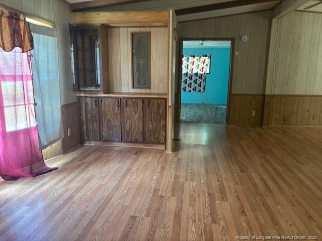 5689 NE Maxwell Rd NW, Stedman, NC 28391 - unfurnished room featuring wooden walls and wood finished floors