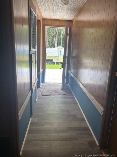 5689 NE Maxwell Rd NW, Stedman, NC 28391 - hallway featuring wooden walls and wood finished floors