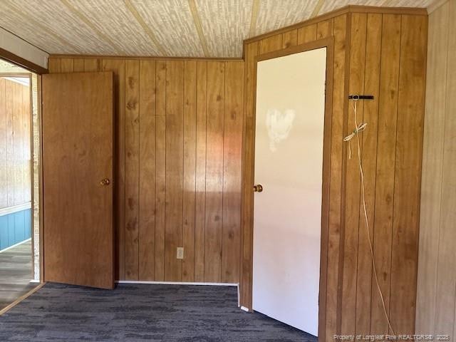 5689 NE Maxwell Rd NW, Stedman, NC 28391 - unfurnished bedroom with wooden walls and wood finished floors
