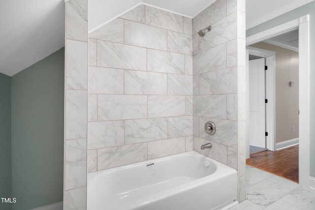 full bath featuring baseboards, bathtub / shower combination, marble look tiles, and crown molding