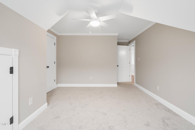 bonus room featuring a ceiling fan, light carpet, and baseboards