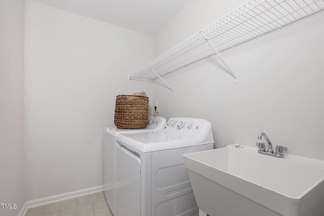 1004 Sora Way, Durham, NC 27703 - washroom featuring washing machine and dryer, baseboards, and light tile patterned floors