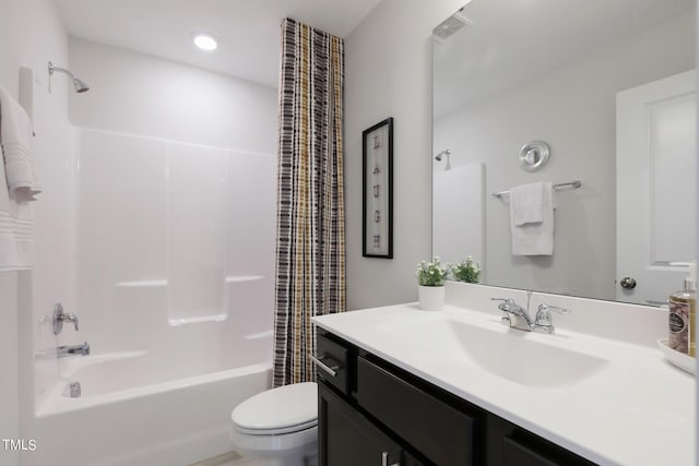 bathroom with toilet, shower / tub combo with curtain, and vanity