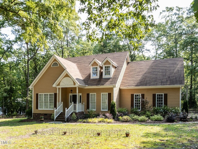 301 Monterey Ct, Benson, NC 27504 - new england style home featuring a front lawn, a shingled roof, and crawl space
