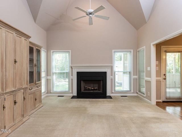 301 Monterey Ct, Benson, NC 27504 - unfurnished living room with carpet, high vaulted ceiling, a fireplace with flush hearth, healthy amount of natural light, and a ceiling fan