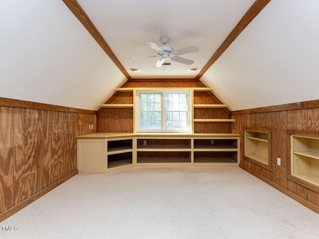 301 Monterey Ct, Benson, NC 27504 - additional living space with wooden walls, built in shelves, ceiling fan, vaulted ceiling, and carpet floors