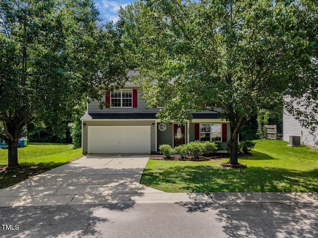 view of property hidden behind natural elements with concrete driveway, an attached garage, central AC, and a front lawn