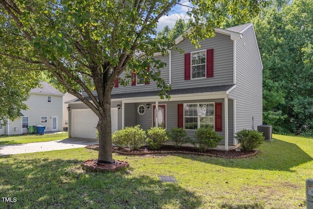 traditional home featuring driveway, a garage, a front lawn, and central AC