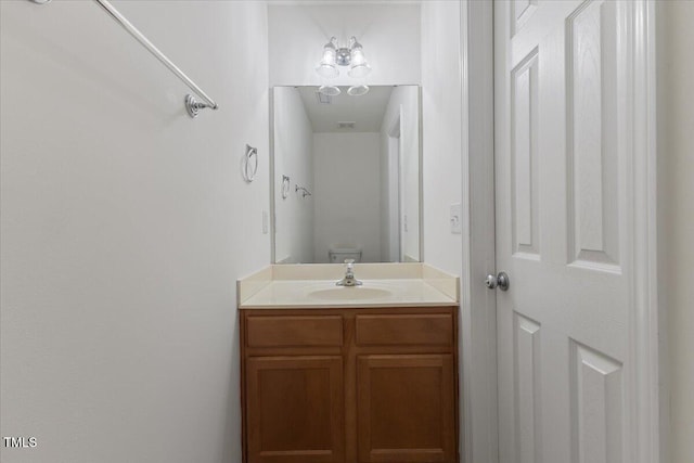 bathroom with vanity and toilet