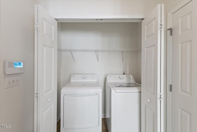 washroom with independent washer and dryer