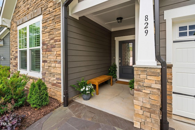 829 Churton Pl, Cary, NC 27518 - property entrance featuring stone siding and a porch