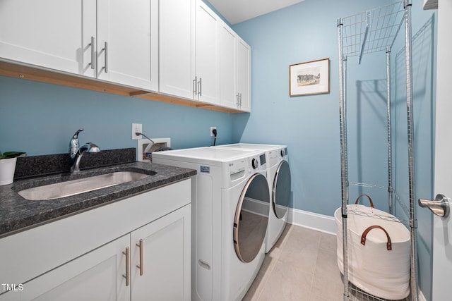 829 Churton Pl, Cary, NC 27518 - laundry room featuring cabinet space, washer and clothes dryer, baseboards, and light tile patterned floors